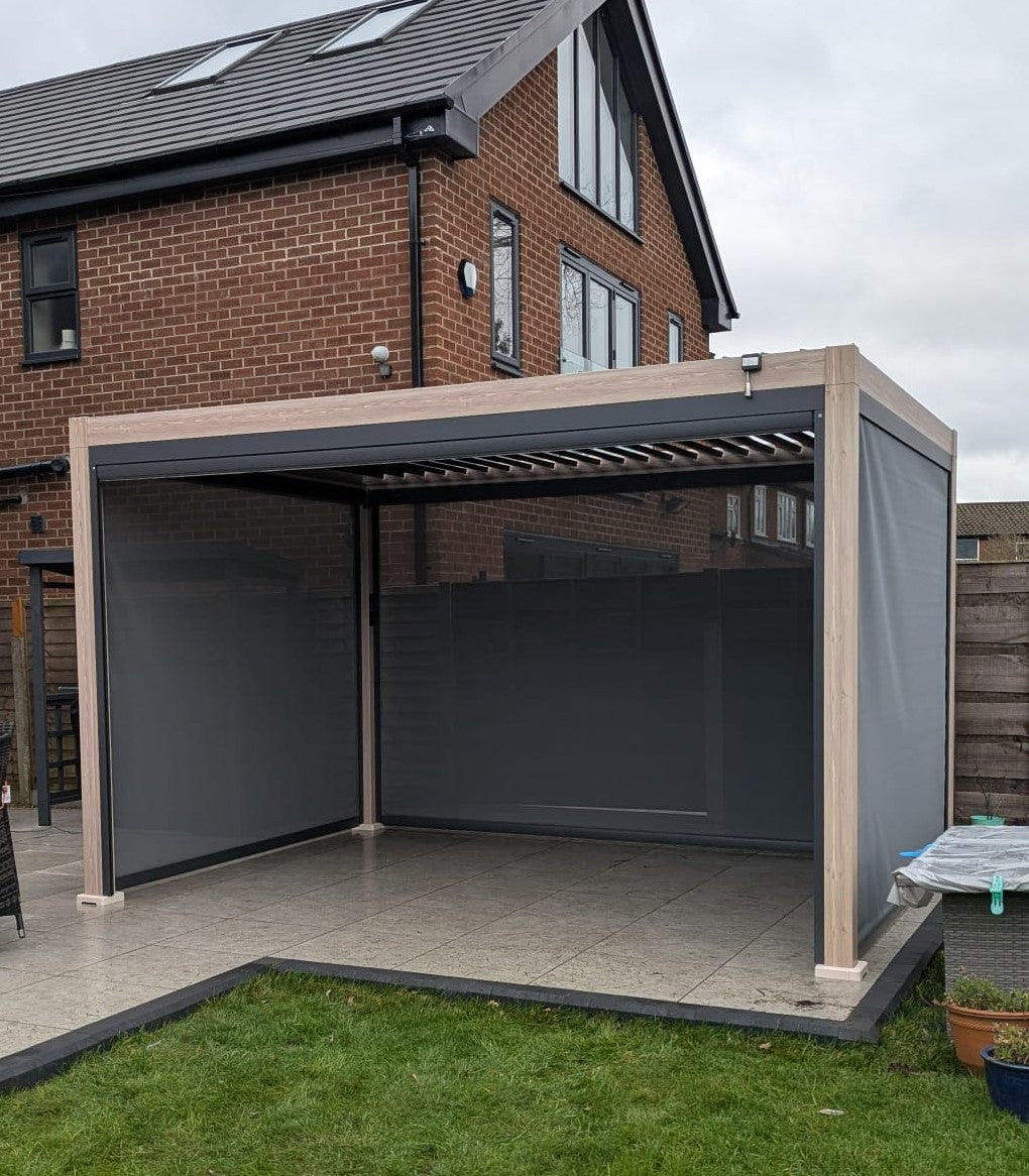 LuxShade™ 3×4m Aluminium Pergola – LEDs, Double-Layer Louvres & 3 Windscreens - Oak Effect